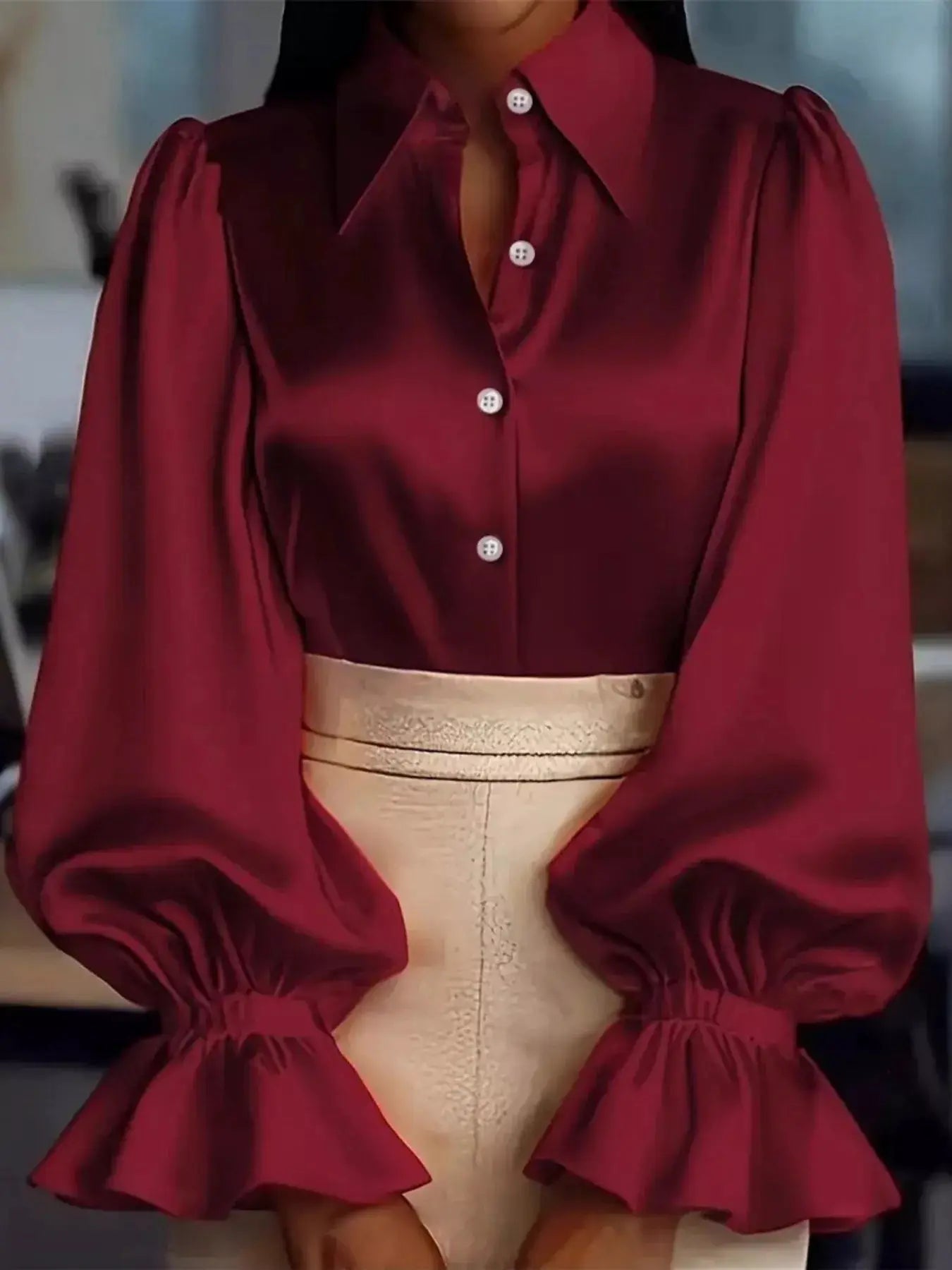 Satin button-up flounce-sleeve shirt in burgundy with ruched detailing and white buttons.