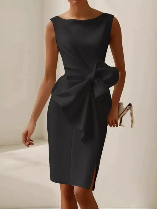 Bow Detail Sleeveless Dress in black with ruched silhouette, large waist bow and side slit; 100% polyester