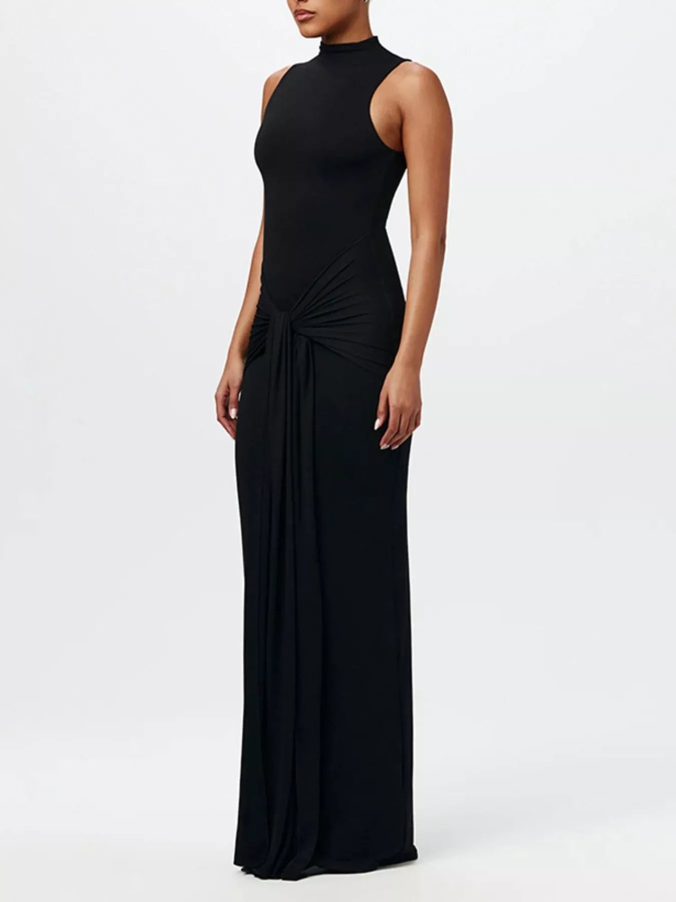 Sleeveless mock-neck knot-front maxi dress in black by Belle Bijouix