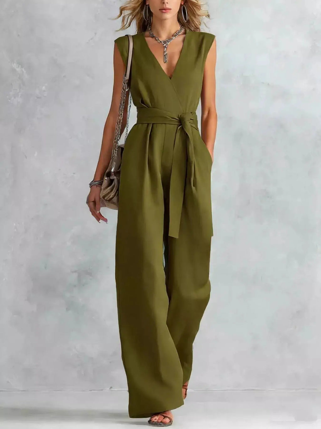 Sleeveless wide-leg jumpsuit in olive green with a tied waist belt