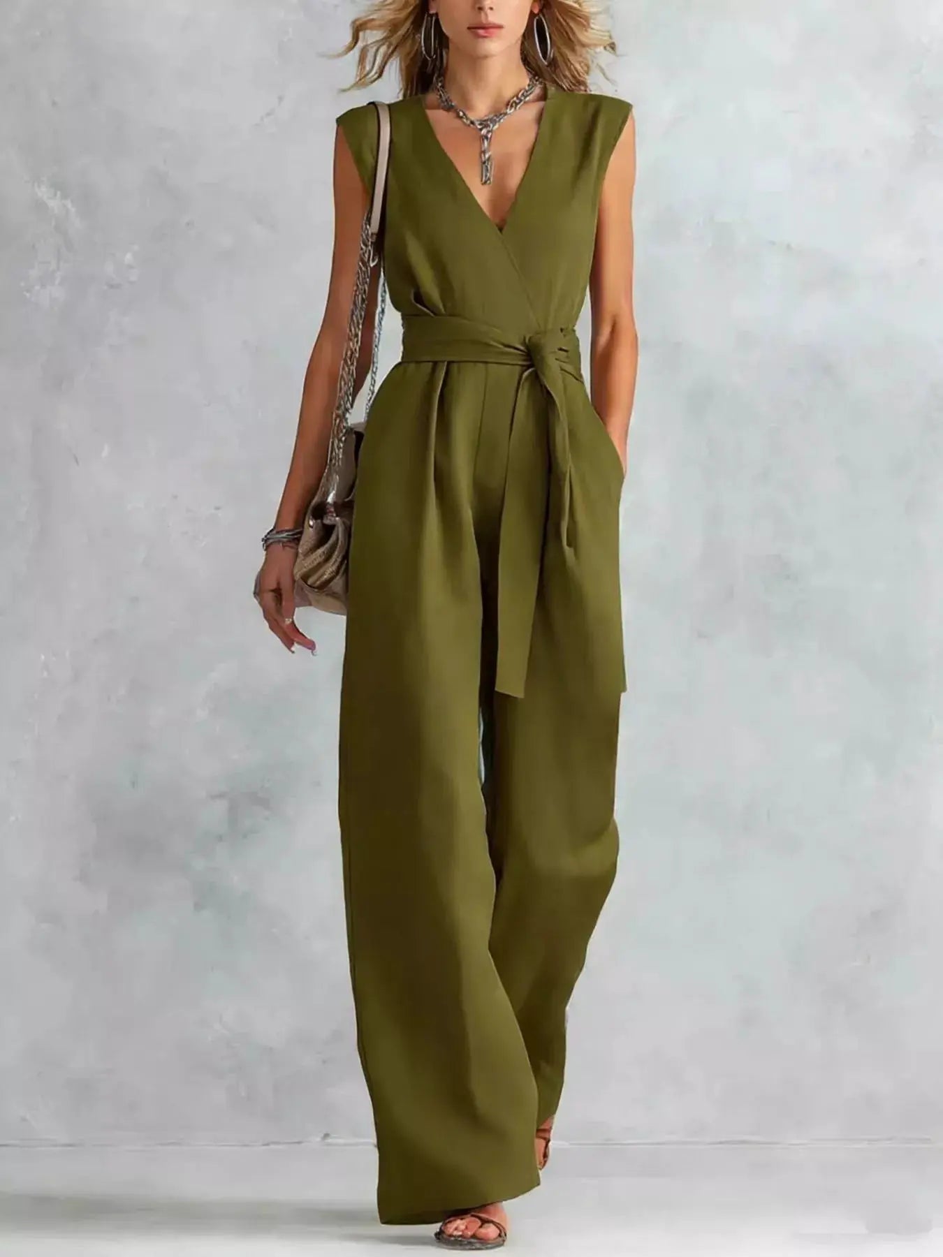 Sleeveless wide-leg jumpsuit in olive green with a tied waist belt
