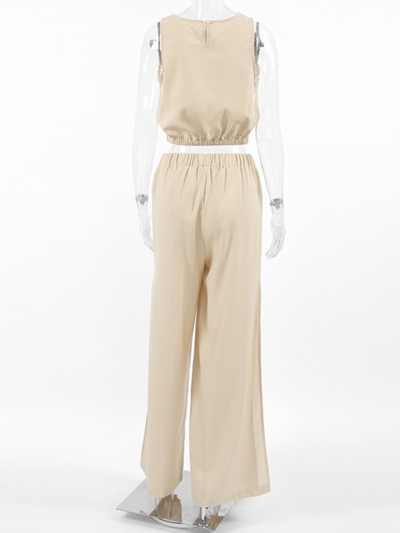 Sleeveless crop top and slit pants set in beige with elastic waist and wide legs