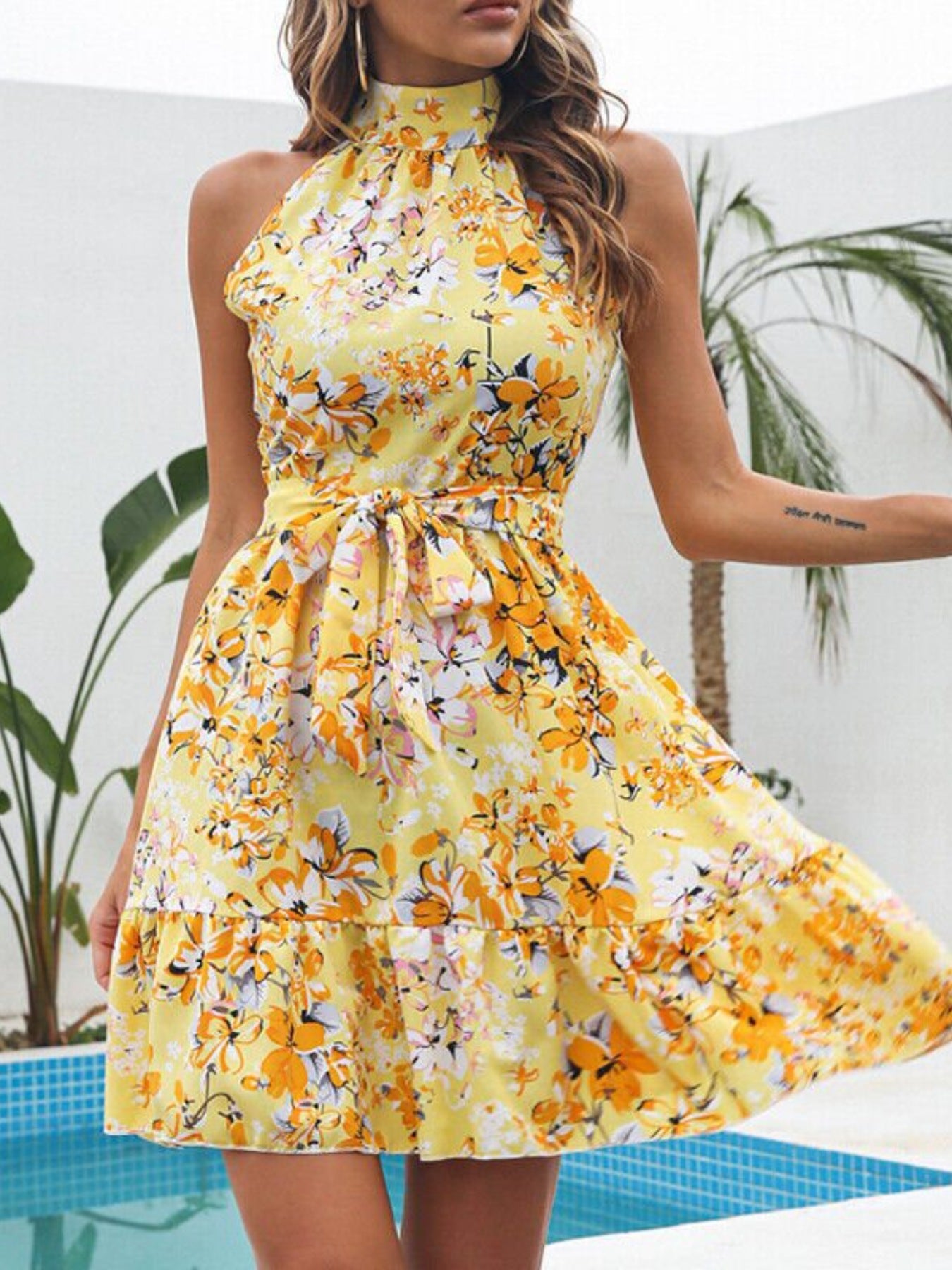 Floral Print Halter Neck Mini Dress by Bellebijouix in yellow with orange and white flowers; ruffled and tied waist.