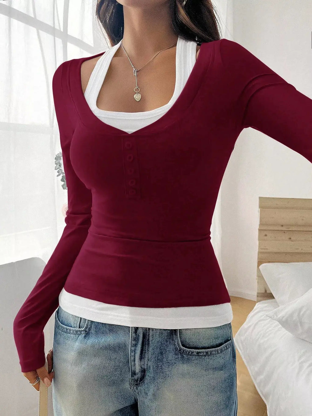 Scoop Neck Long Sleeve T-Shirt in burgundy with front button placket, layered over a white tank top.