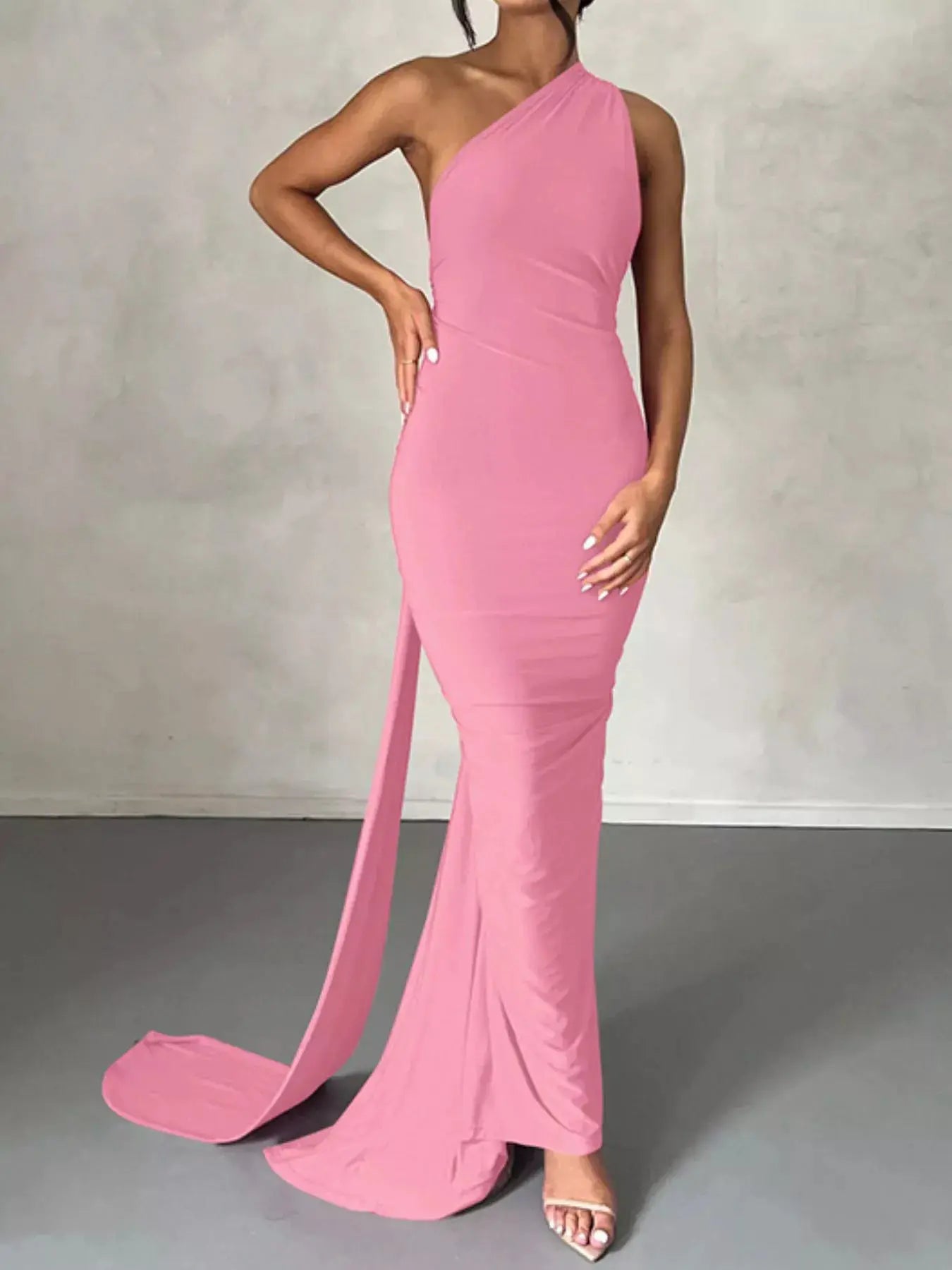Backless One-Shoulder Ruched Bodycon Maxi Dress in pink with a flowing train.