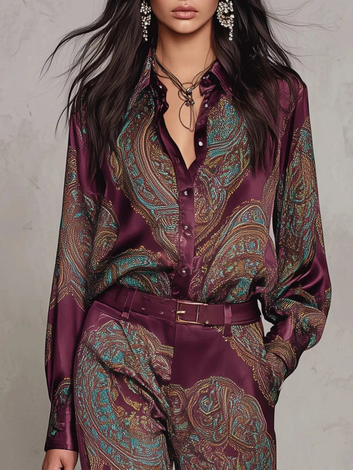 Close-up of burgundy paisley button-front shirt and matching pants waist