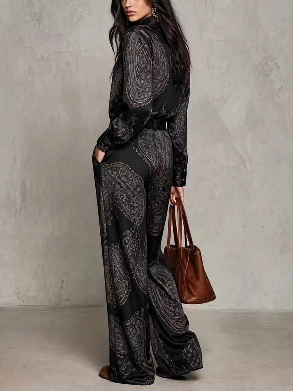 Rear three-quarter view of black paisley shirt and wide-leg pants set