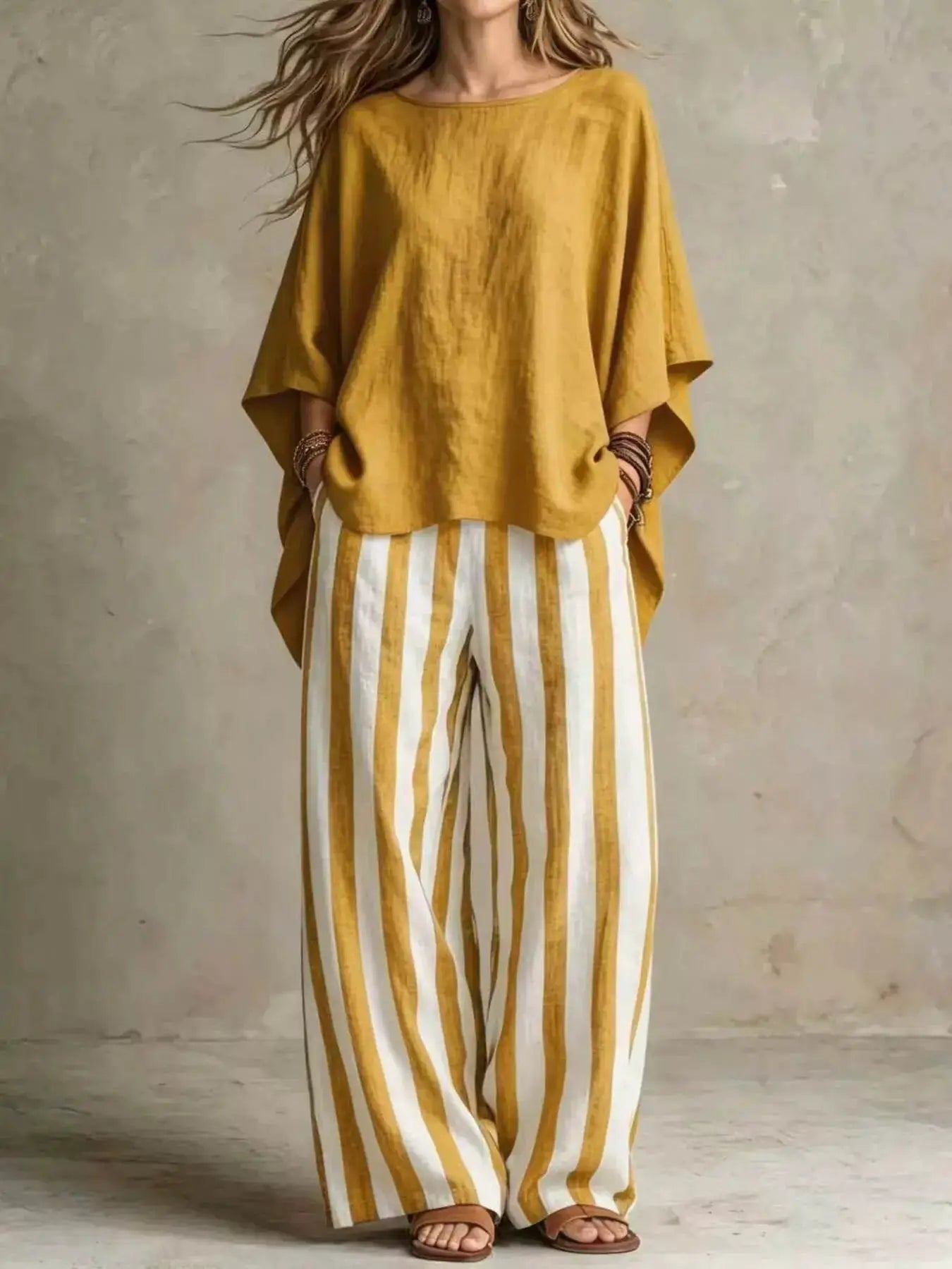 Plus-size outfit set: mustard-yellow oversized top with white and mustard vertical-striped wide-leg pants