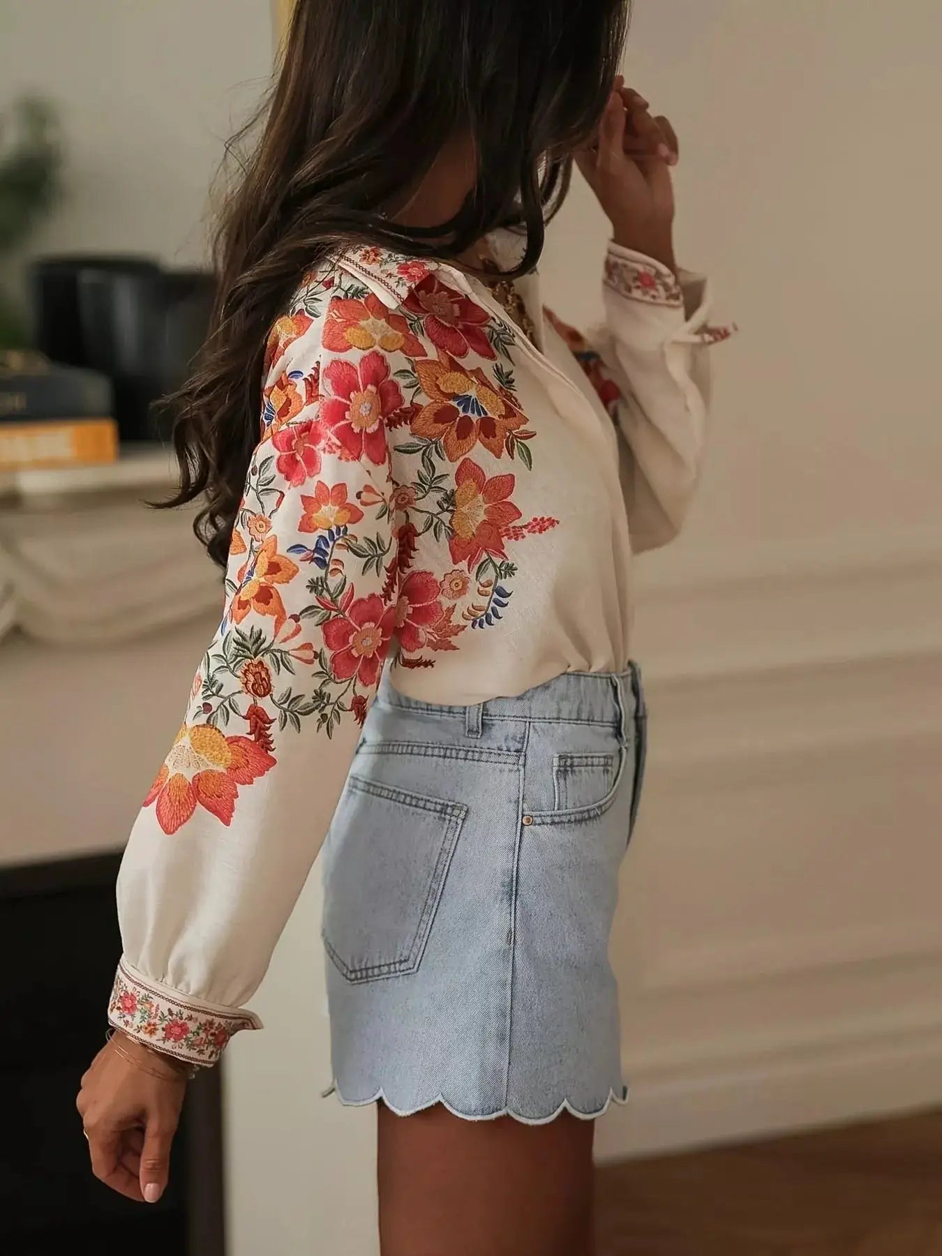 Floral Print Button-Up Shirt by Belle Bijouix, cream base with orange-red flowers.