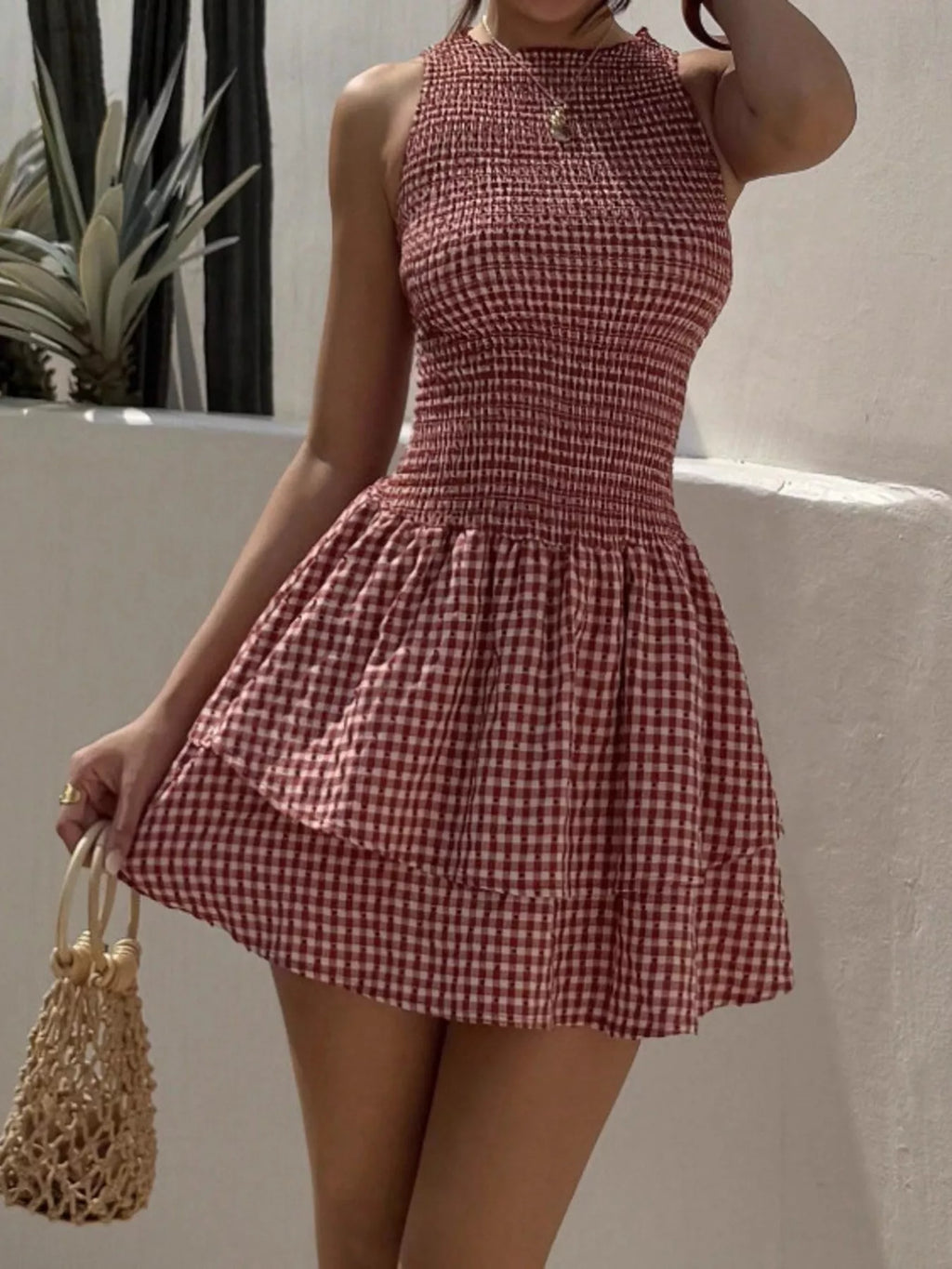 Gingham Smocked Mini Dress by Trendsi in red-and-white check, sleeveless with a smocked bodice and flared mini skirt