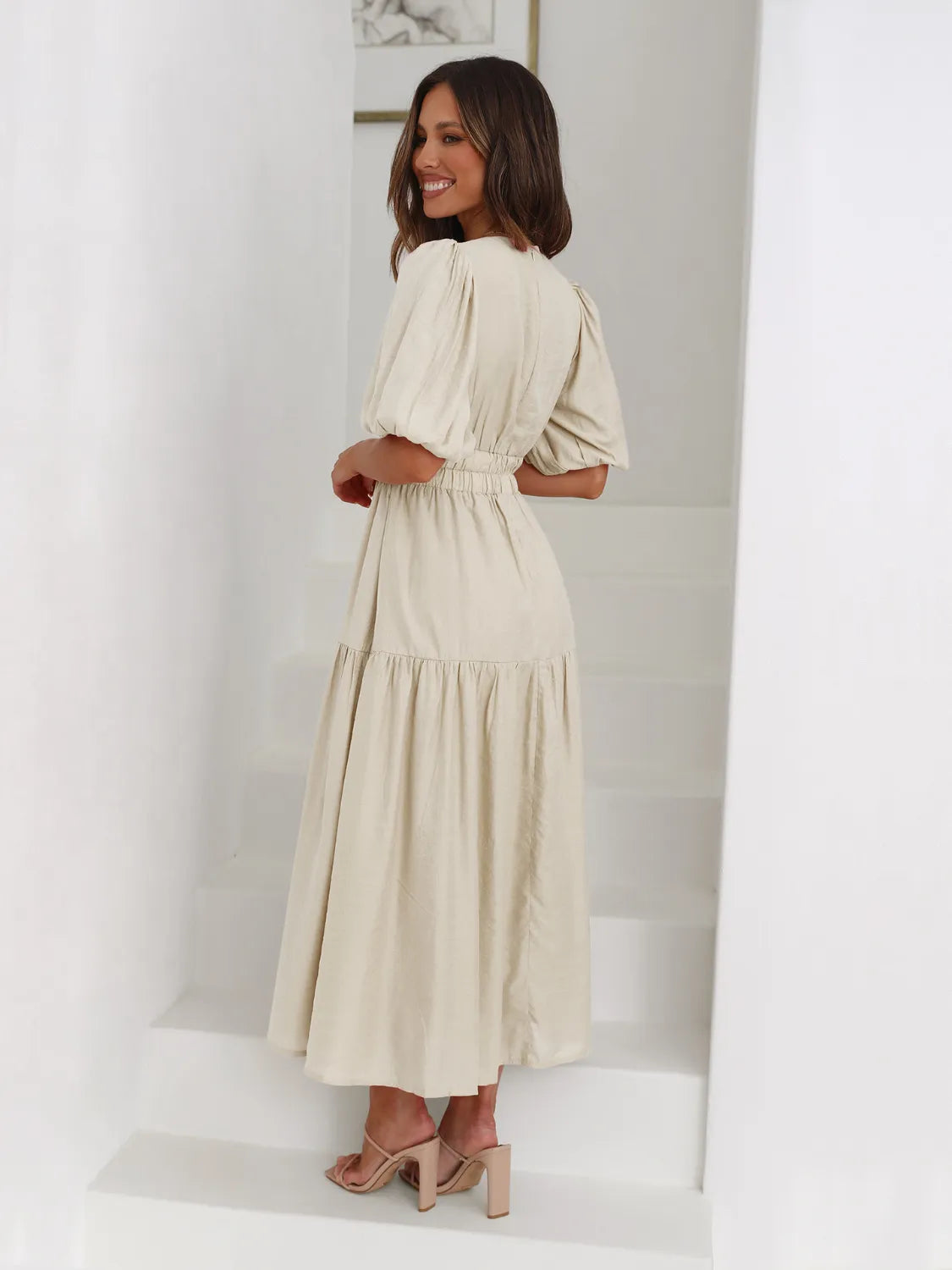 Tiered surplice half-sleeve midi dress by Belle Bijouix in cream-beige fabric.