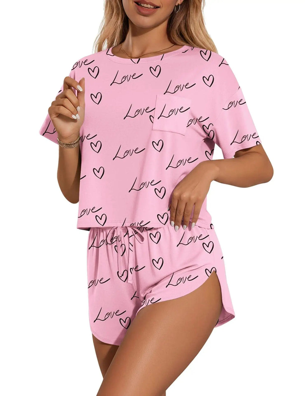 Printed pink round-neck tee and shorts set with black love hearts pattern, by Trendsi
