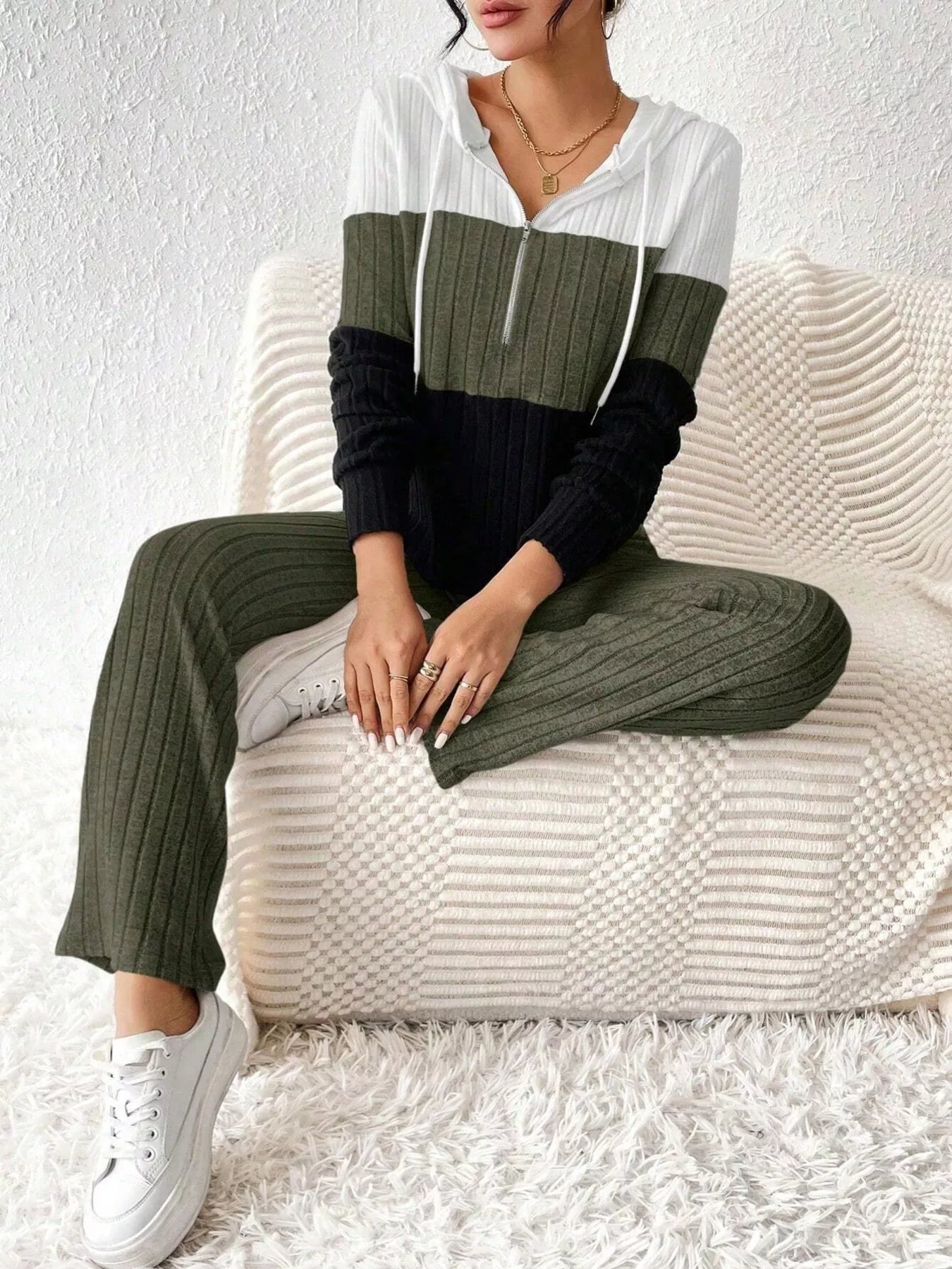 Color block ribbed knit half-zip hooded top and pants set in white, olive, and black; two-piece active loungewear.