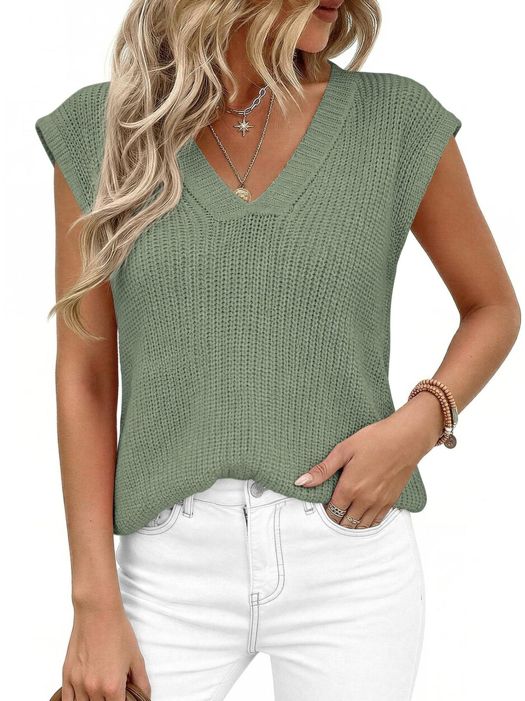 V-Neck Sweater Vest in sage green knit, sleeveless with cap shoulders, worn over white jeans