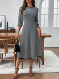 Trendsi plaid round-neck dress with 3/4 sleeves in black and white gingham, midi length