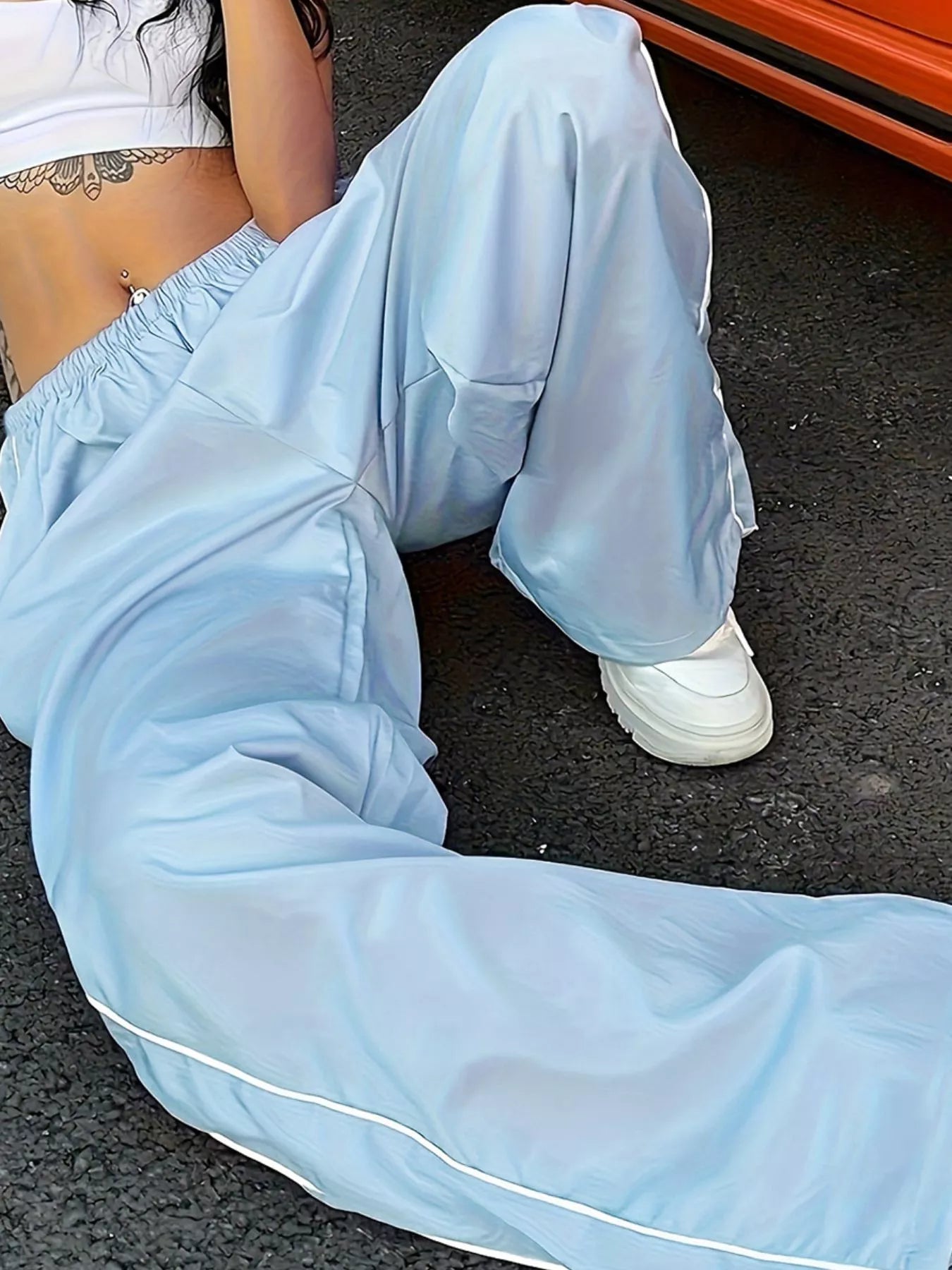 Elastic waist wide-leg pants by Trendsi in light blue, relaxed fit