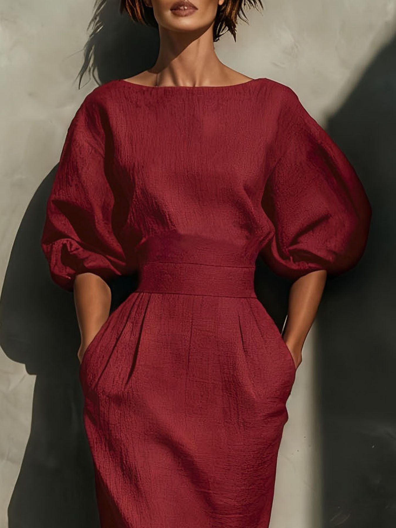 Round Neck Puff Sleeves Midi Dress in burgundy with textured fabric and a defined waistband