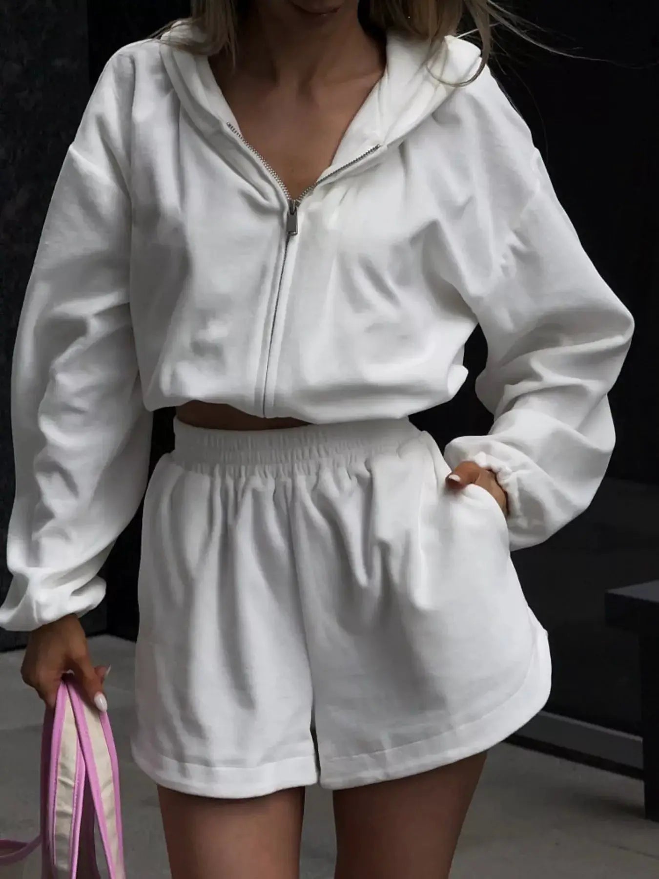 Long sleeve zip-up cropped hoodie and shorts set in white; women's activewear two-piece.