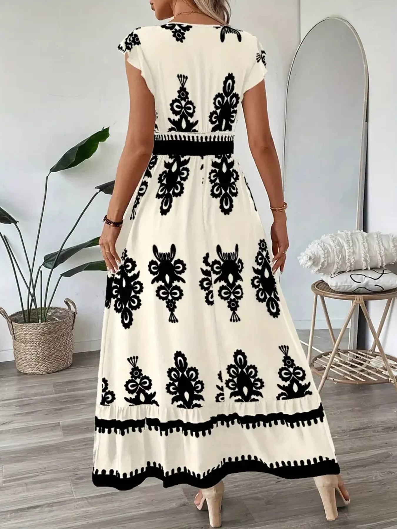 Printed V-Neck Ruffled Cap Sleeve Dress with cream base and black damask print, smocked waist.
