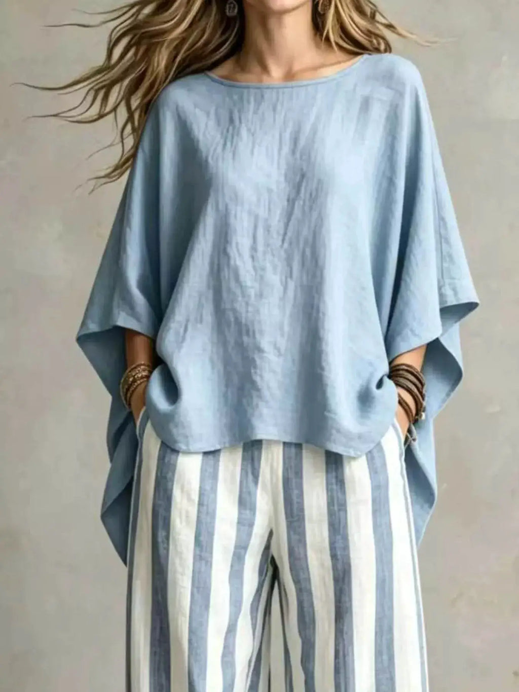 Plus-size 2-piece top and pants set with a loose light-blue oversized top and striped pants