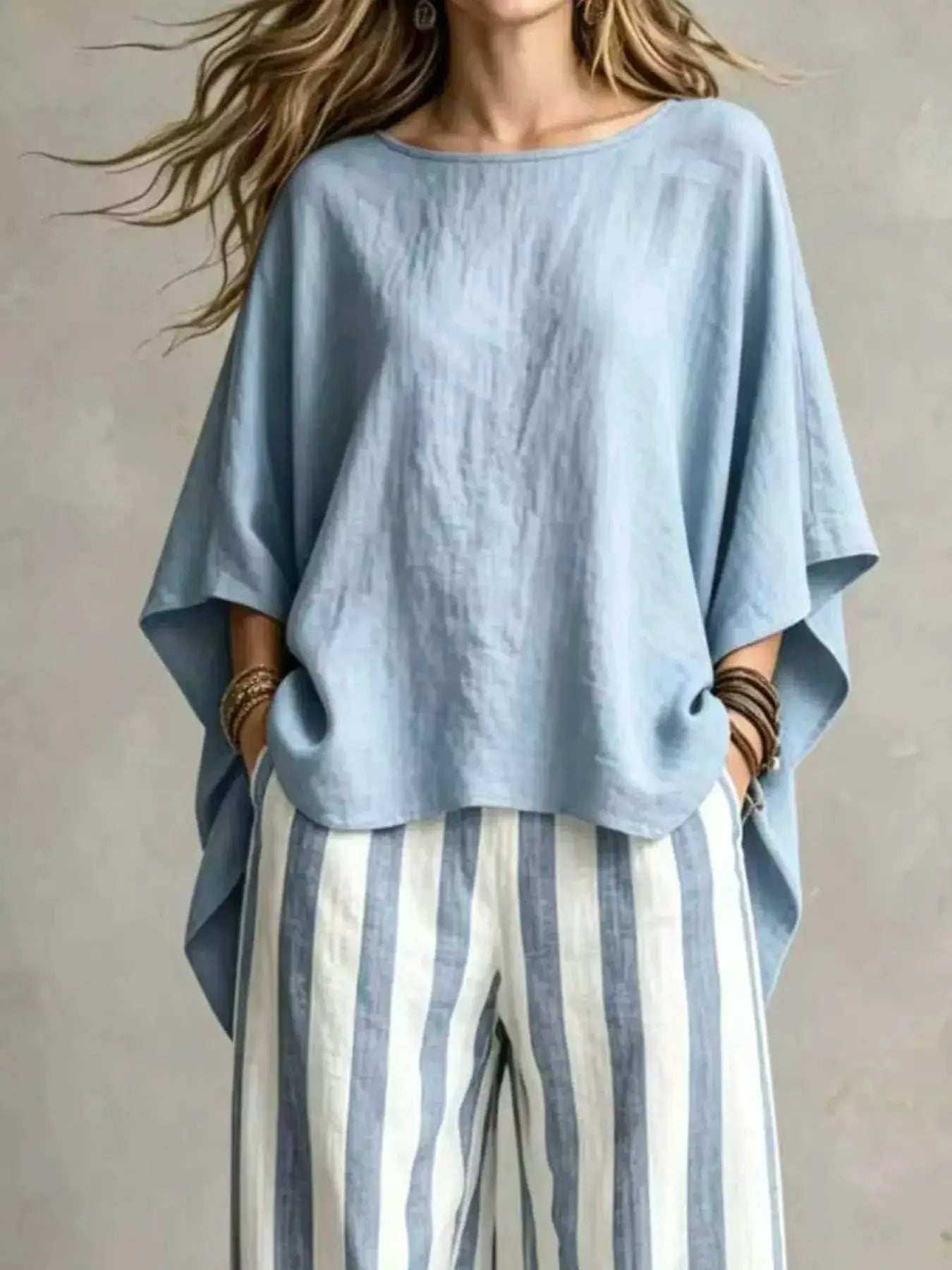 Plus-size 2-piece top and pants set with a loose light-blue oversized top and striped pants