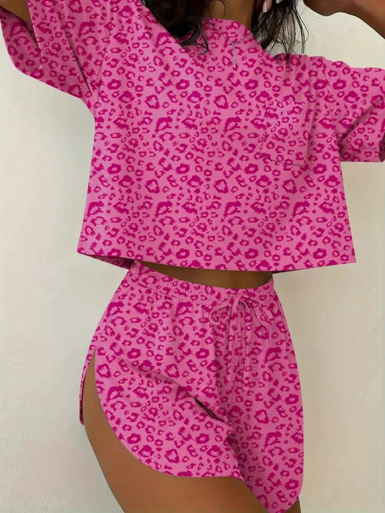 Two-piece printed pink leopard round-neck tee and shorts set from Trendsi.