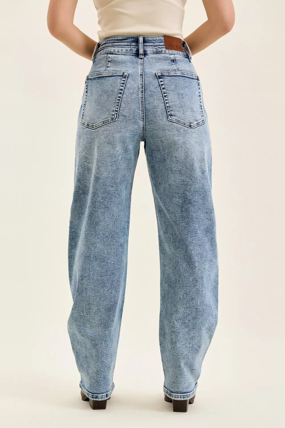 Judy Blue high-waist Marlow arc-leg jeans in light wash denim, plus size, by Trendsi with classic back pockets.