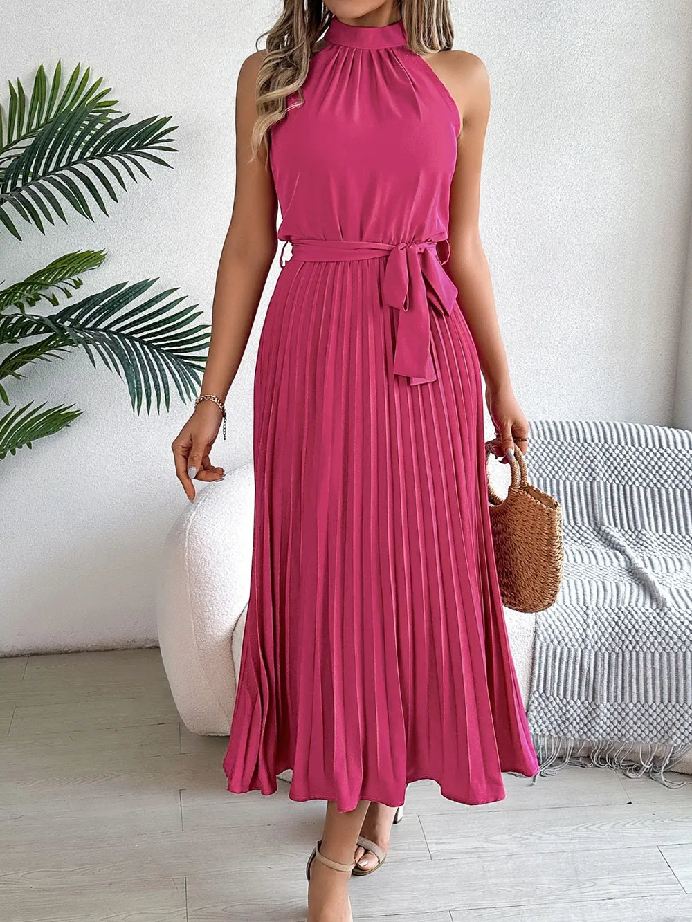 Pleated tie-waist sleeveless midi dress in magenta by Belle Bijouix.