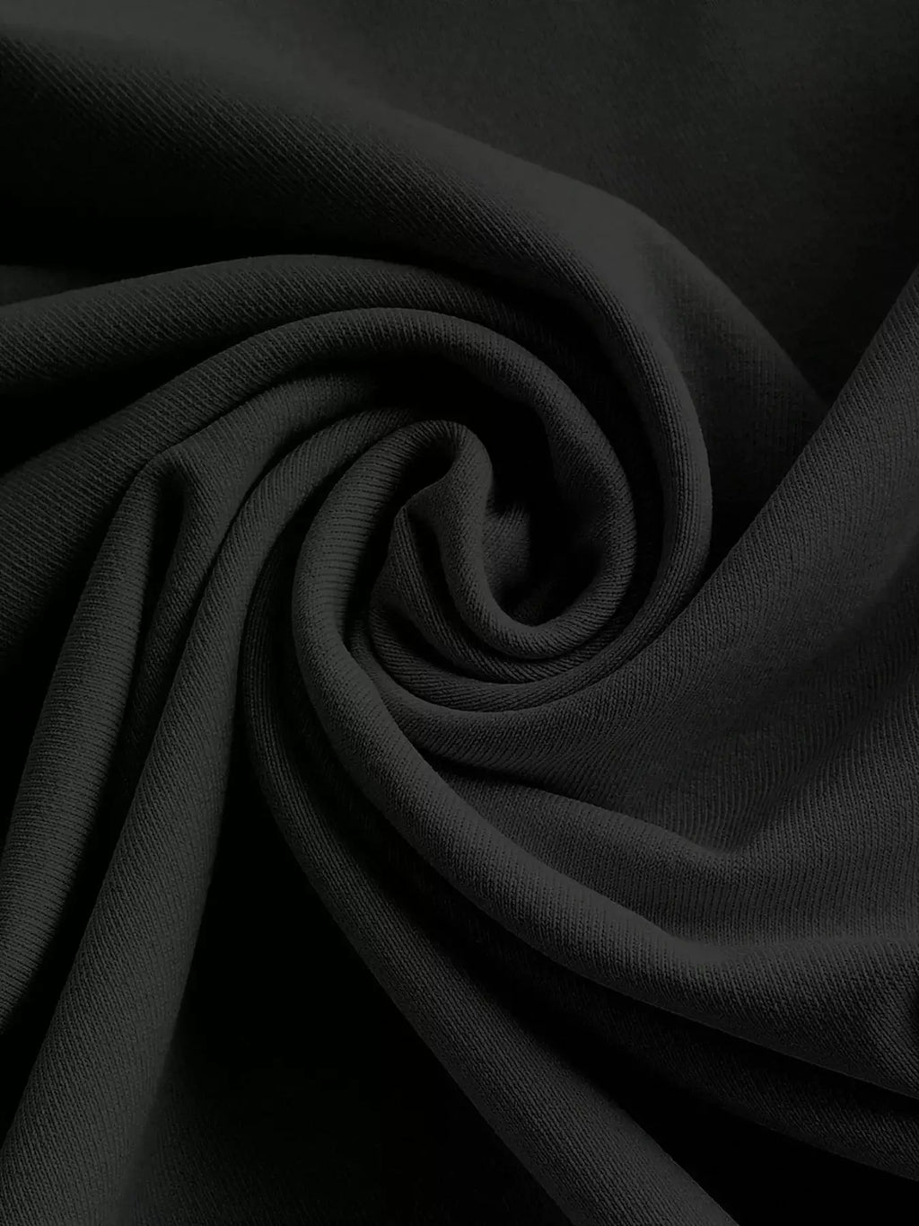 Black stretch fabric swatch folded in spirals for Belle Bijouix dresses
