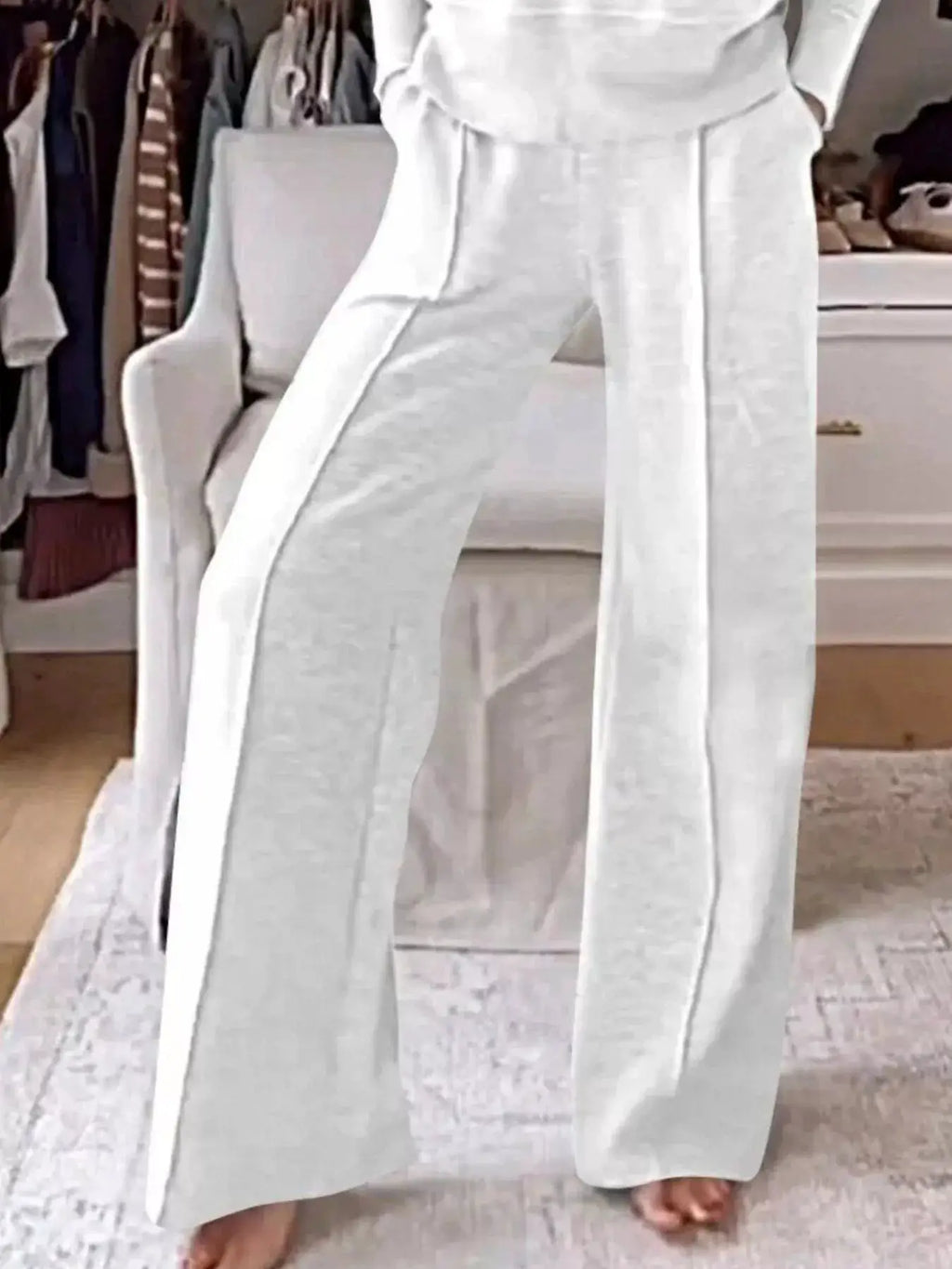 Plus-size cozy v-neck top and pants lounge set in white with pockets and full-length pants.