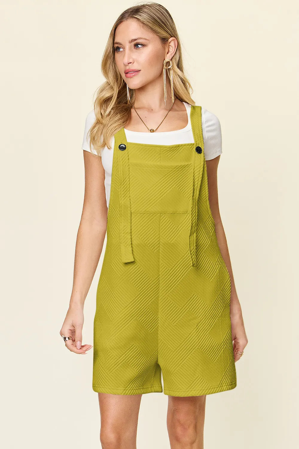 Double Take Full Size Texture Sleeveless Romper in lime green with a bib front, shoulder straps, and a belt.