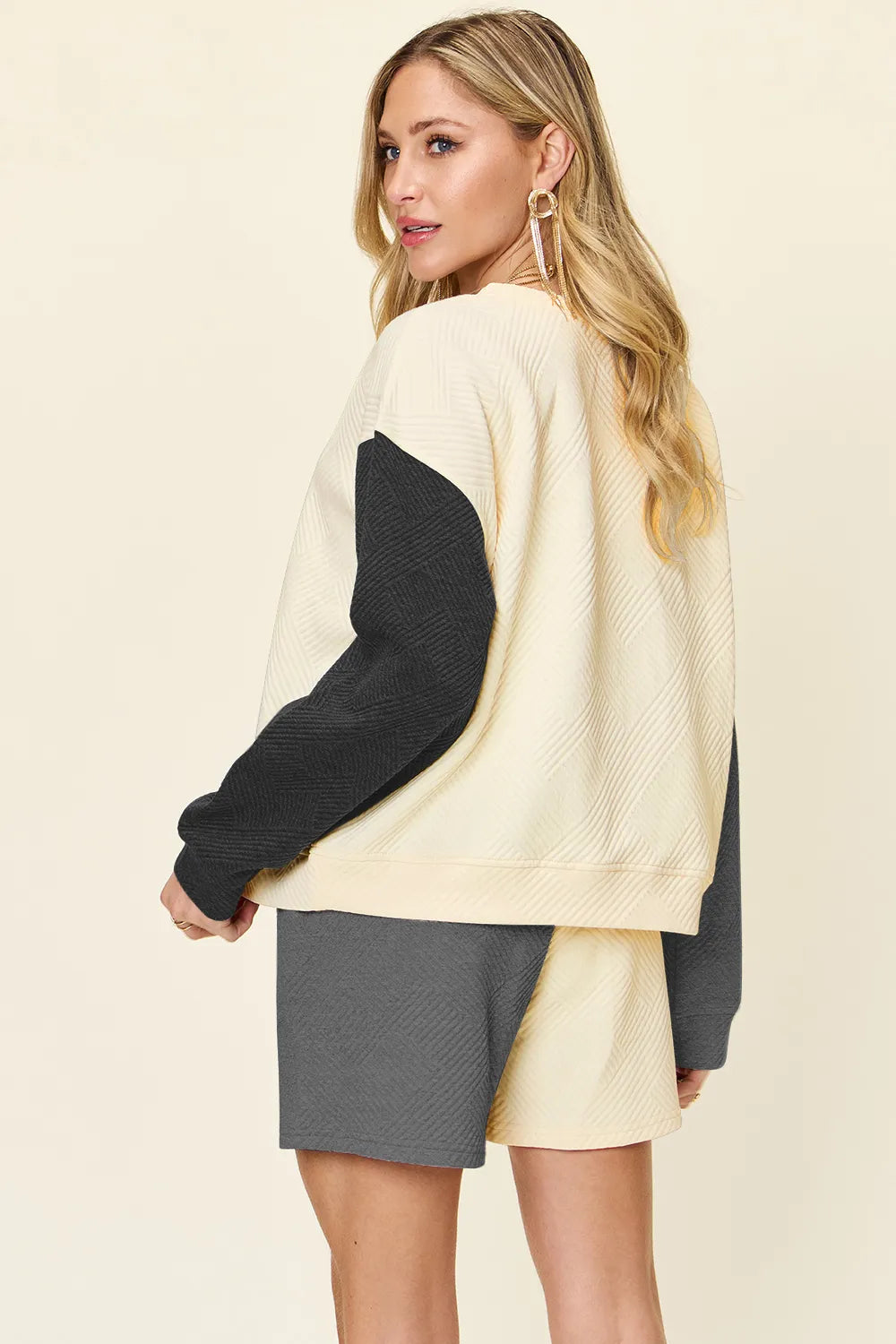 Belle Bijouix Double Take full-size two-piece active-wear set: cream pocketed top with dark sleeves and gray shorts