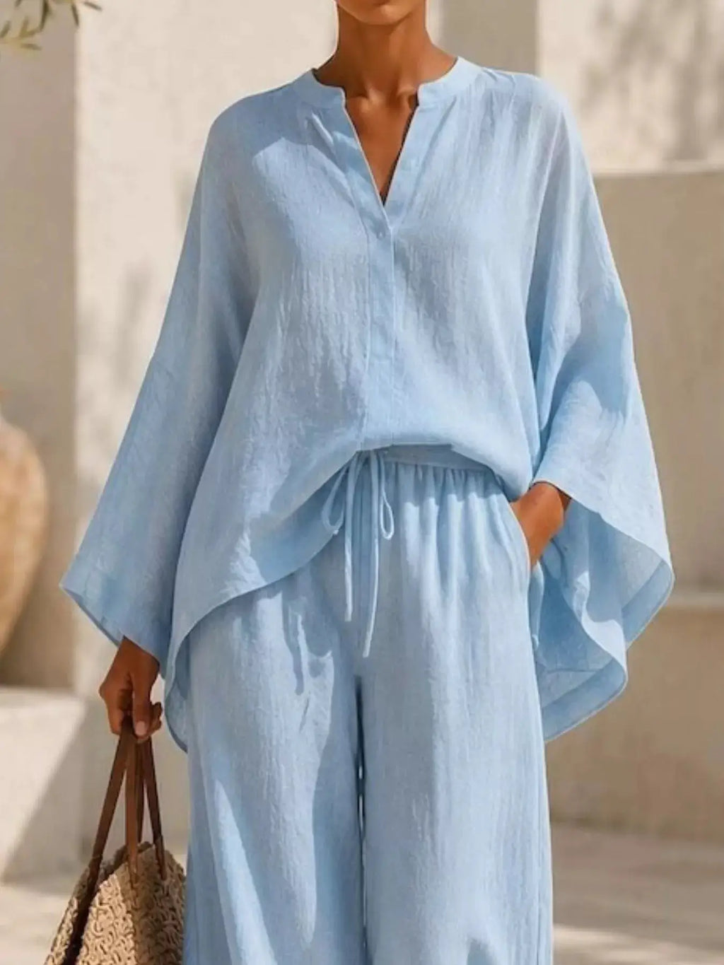 Plus Size Notched Long Sleeve Top & Wide-Leg Pants Set in light blue fabric, Belle Bijouix