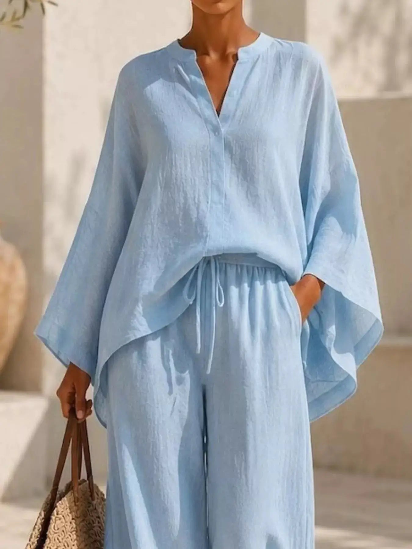 Plus Size Notched Long Sleeve Top & Wide-Leg Pants Set in light blue fabric, Belle Bijouix