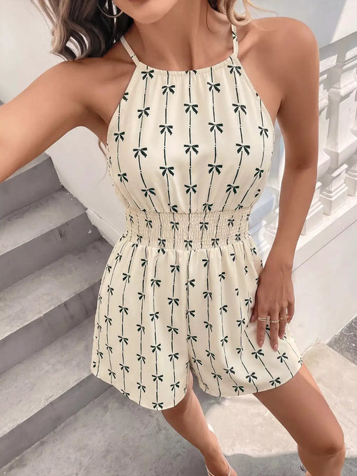 Bow-print halter neck smocked romper in ivory with green bows; elastic smocked waist, by Trendsi