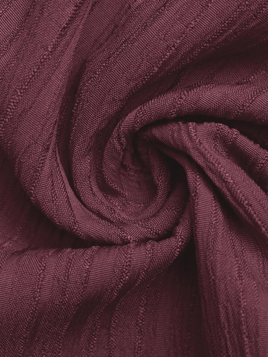 One-shoulder tie-waist romper fabric close-up in burgundy knit