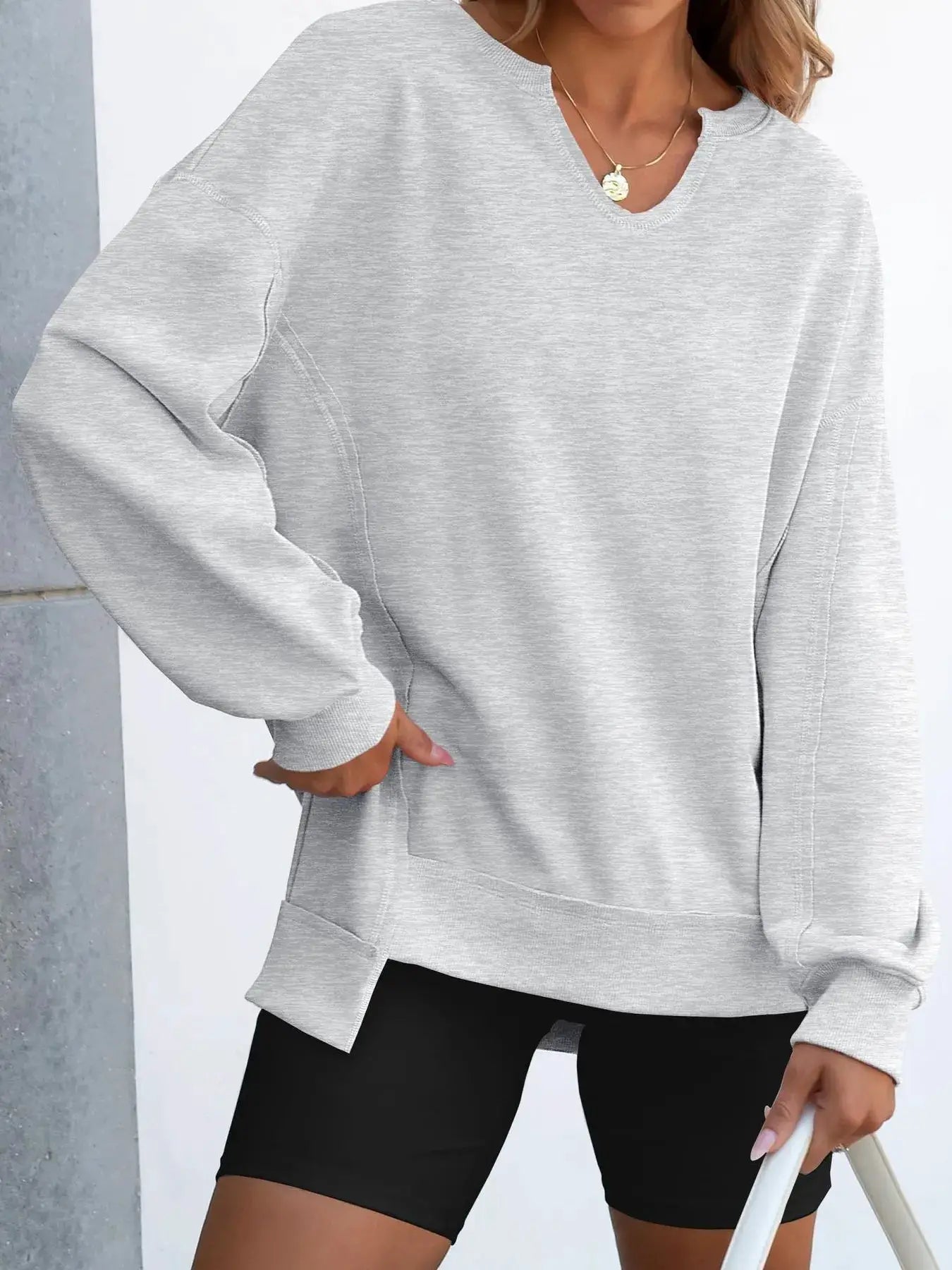 Notched long sleeve oversized sweatshirt in light gray.