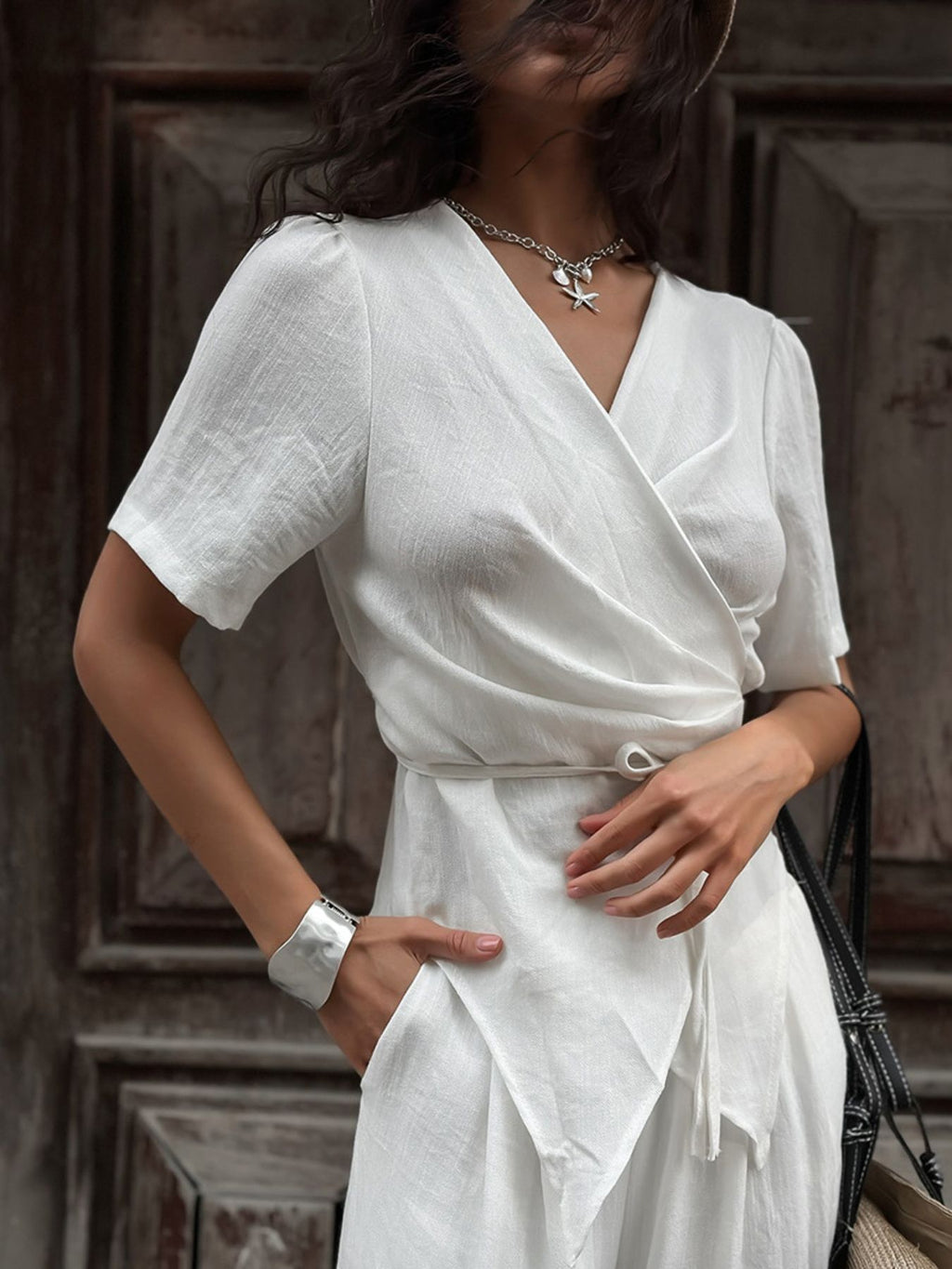 Wrap Top & Wide Leg Pants Set by Belle Bijouix in white; V-neck wrap top with tied waist.