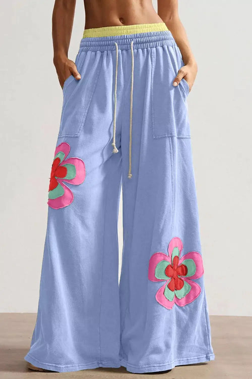 Pants by Belle Bijouix: light-blue wide-leg with drawstring elastic waist and bright flower patchwork