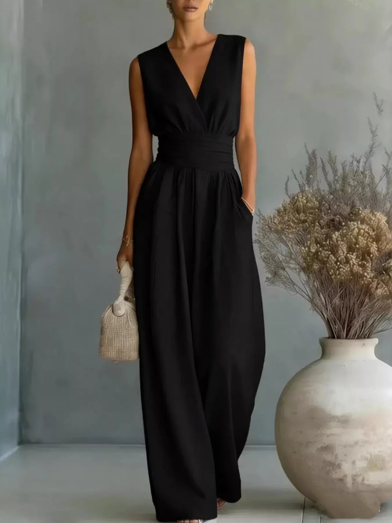Full Size Sleeveless Wide-Leg Jumpsuit in black by Trendsi, plus size