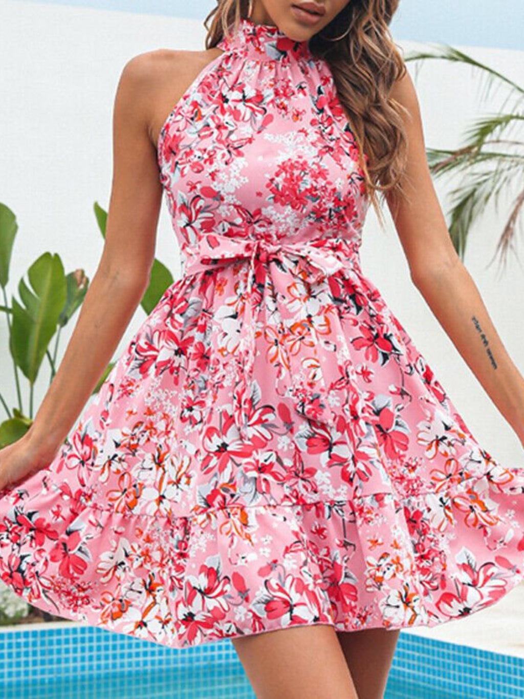 Floral Print Halter Neck Mini Dress in pink with a tied waist and ruffled detail