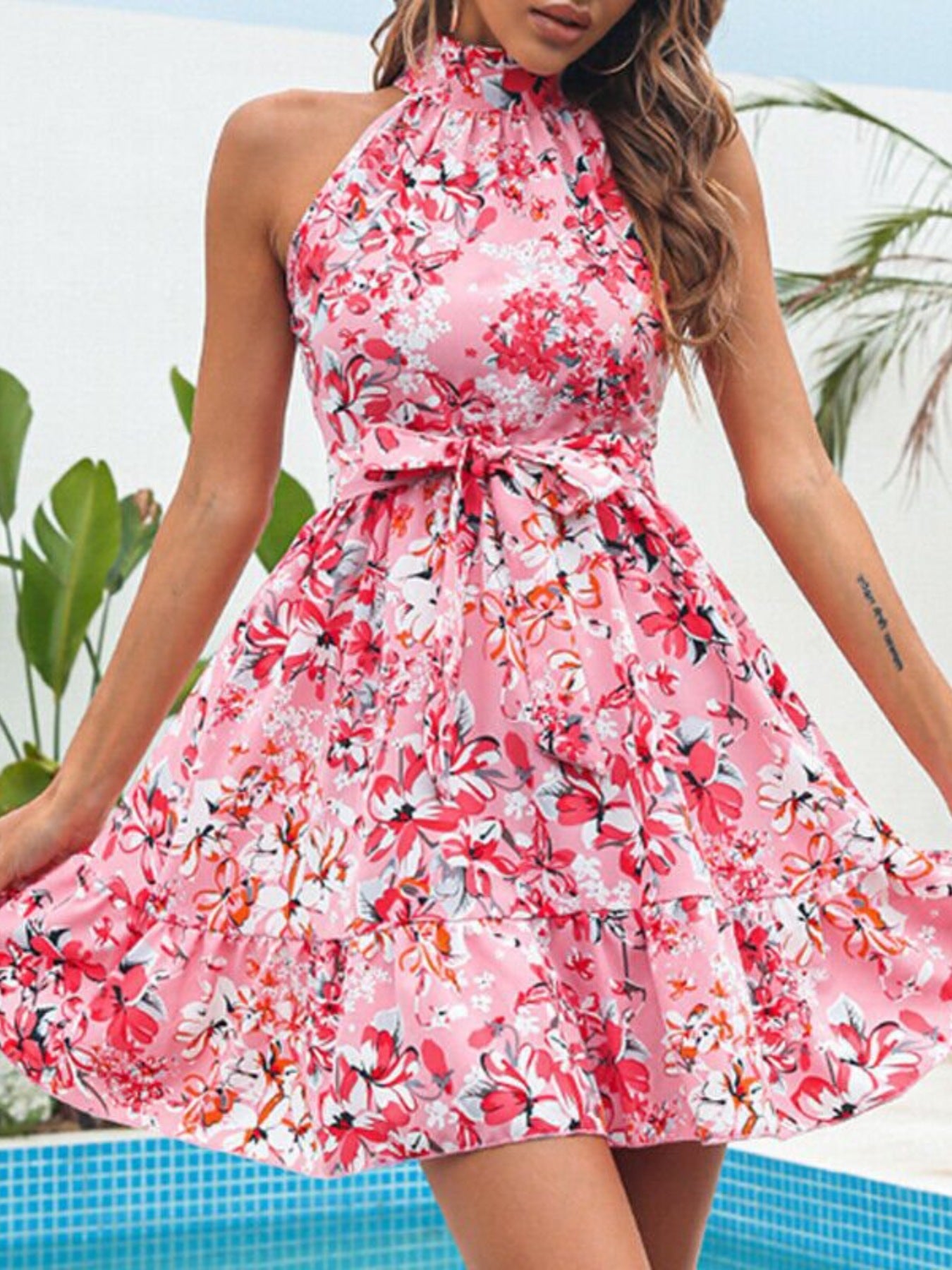 Floral Print Halter Neck Mini Dress in pink with a tied waist and ruffled detail