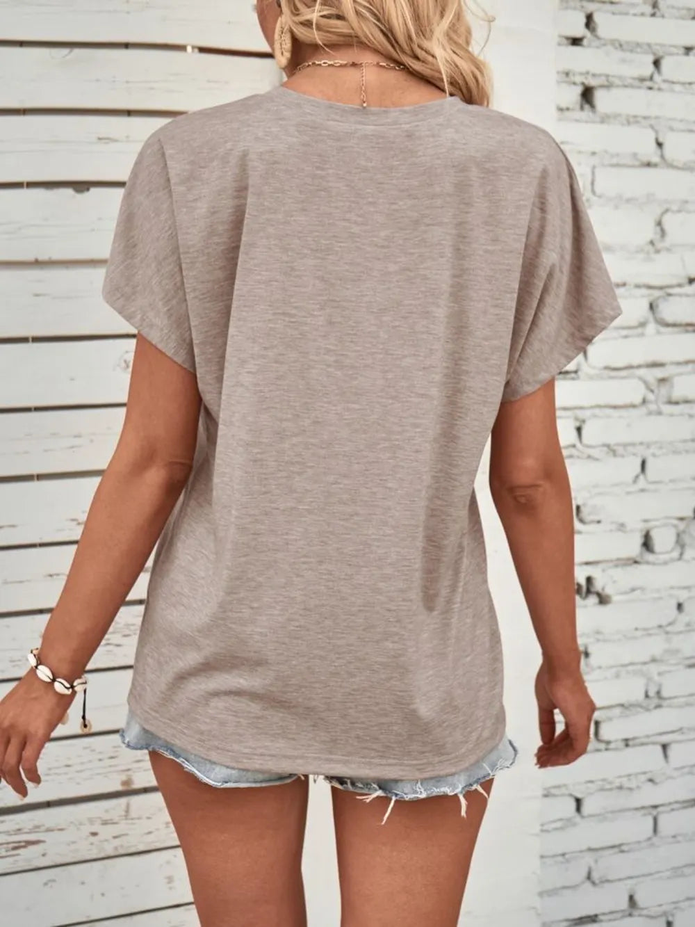 Half Button Short Sleeve Top in taupe, loose-fit back view.