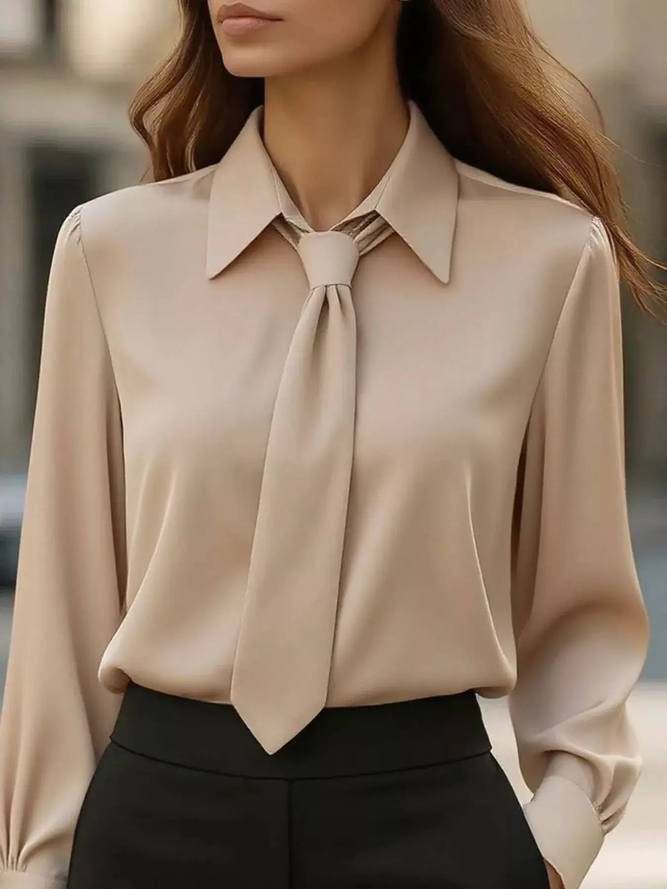Collared-neck beige blouse with a front tie and long sleeves