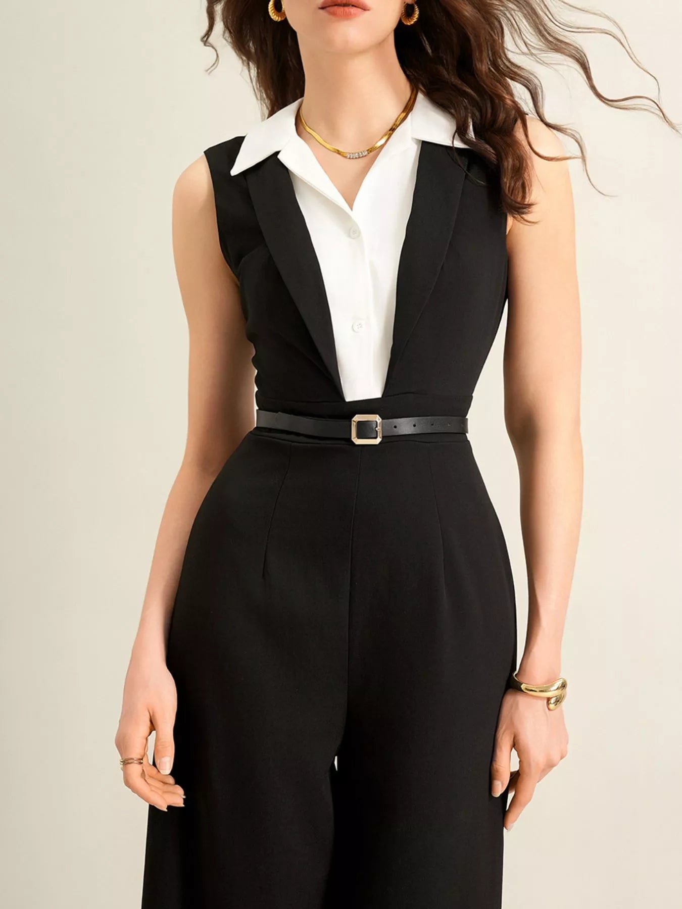 Sleeveless wide-leg jumpsuit in black with white collared shirt and belt by Trendsi