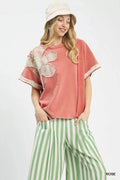 Umgee French Terry Top with Flower Patch in rose pink featuring beige lace floral applique on shoulder.