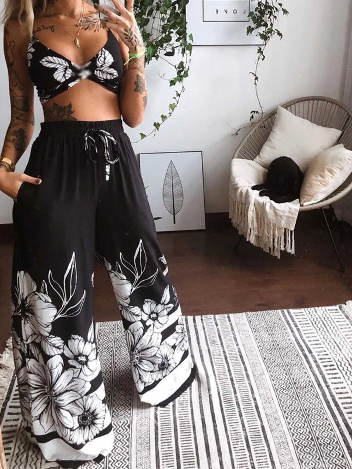 Boho butterfly print top and pants set in black with white floral prints, cropped top.