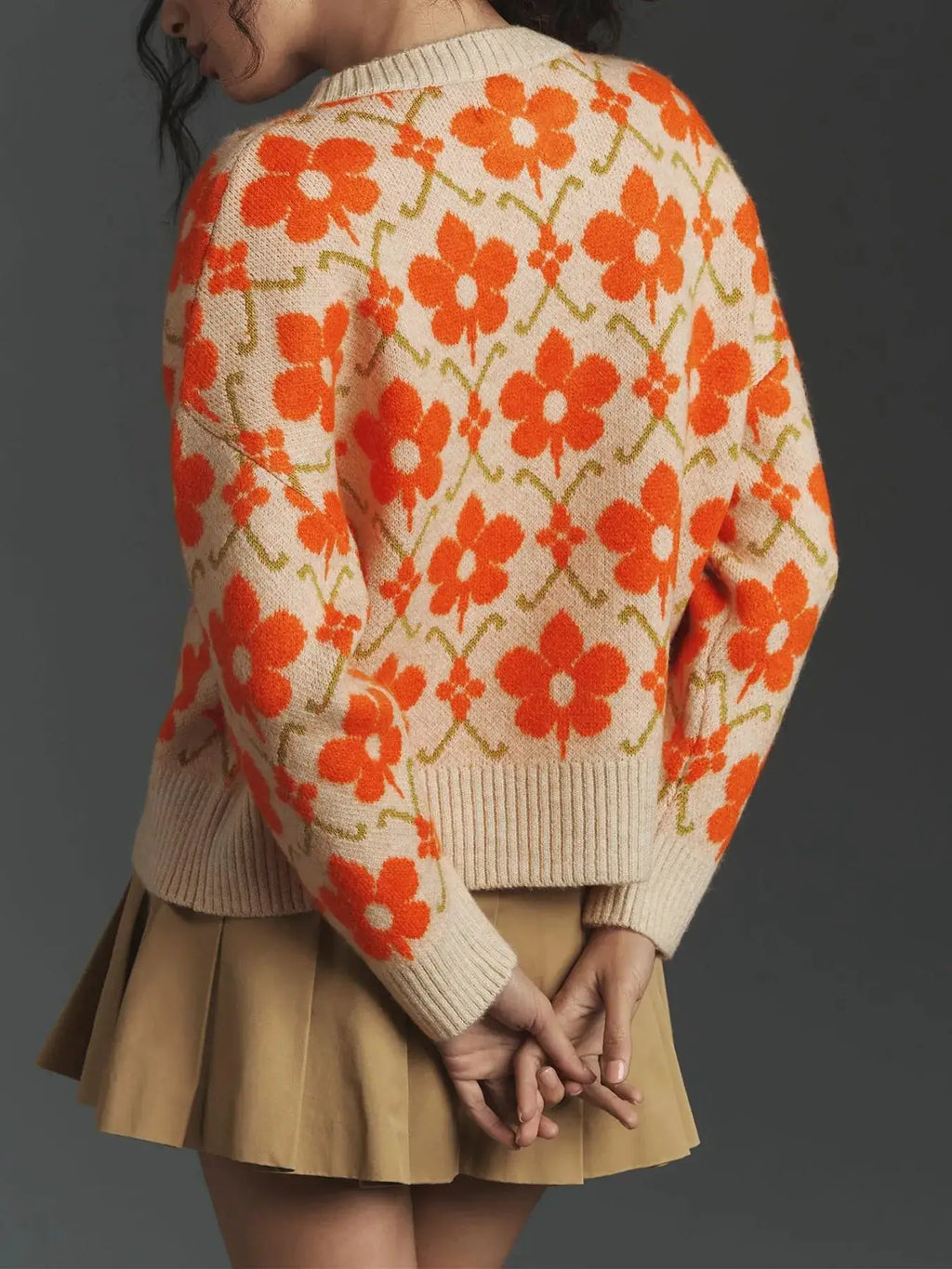 Flower button-up knit cardigan in cream with orange floral pattern, long sleeves.