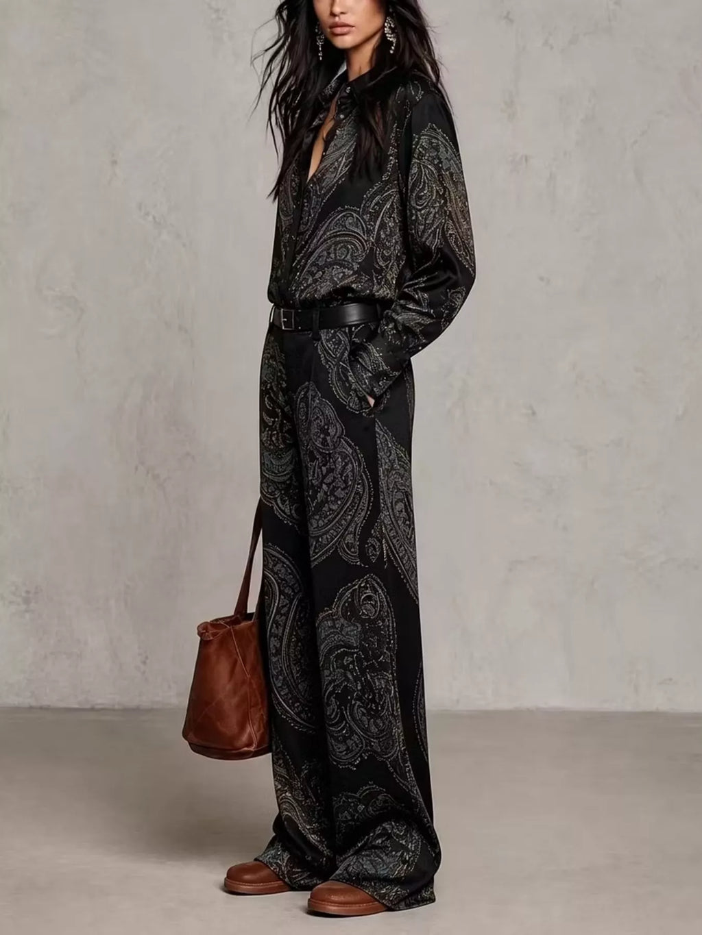 Side view of black paisley shirt and wide-leg pants set