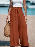 Full Size Drawstring Waist Wide Leg Pants by Belle Bijouix in rust brown with a tied waist